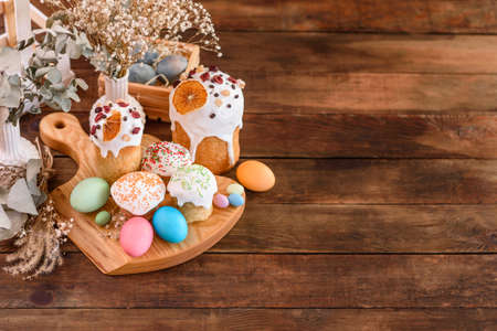 Easter cake and Easter eggs festive celebration table setting traditional decoration and treatsの写真素材