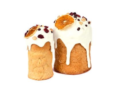 Easter cake with a white cap made of icing and colored powder isolated on whiteの写真素材