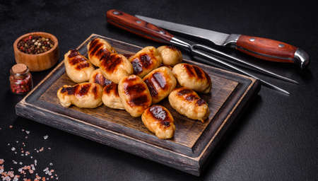 Delicious sausages grilled with spicy sauce. Selective focusの写真素材