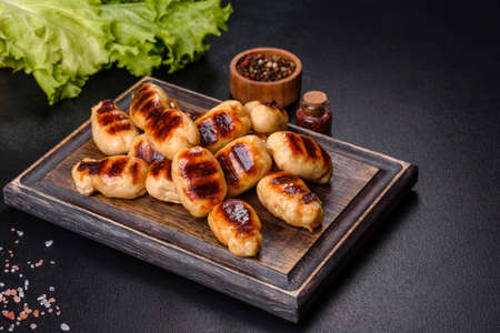 Delicious sausages grilled with spicy sauce. Selective focusの写真素材