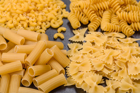 Layout of Italian raw pasta, top view, different types and shapes of pastaの写真素材