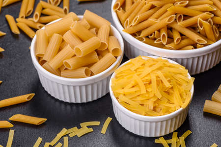 Layout of Italian raw pasta, top view, different types and shapes of pastaの写真素材