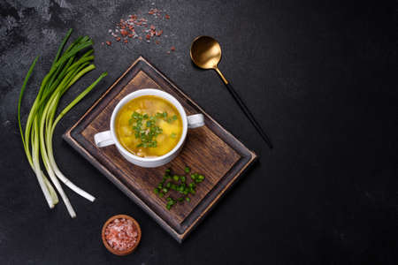 Yellow split pea soup with bacon. Space for text, top viewの写真素材