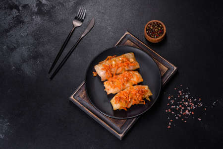 Traditional stuffed cabbage with minced meat and rice, served in a tomato sauce