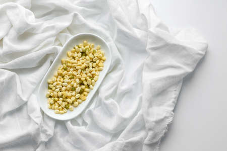 Green mung beans in a bowl on a dark concrete table. Legume plant for a healthy dietの写真素材