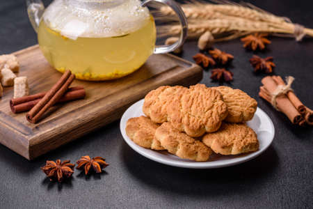 Homemade corn cookies on a dark concrete background. Copy space