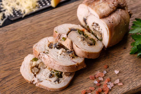 Delicious fresh meat roll made from chicken fillet, mushrooms, spices and herbs. Delicious healthy dish cooked at homeの写真素材