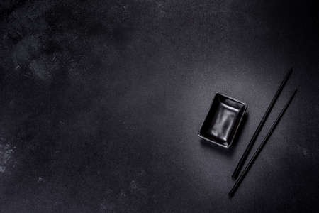 Wooden sushi sticks on a dark concrete background. Japanese Asian cuisineの写真素材
