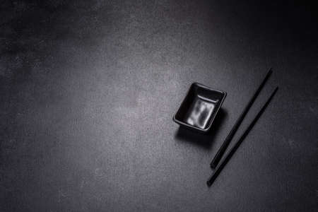 Wooden sushi sticks on a dark concrete background. Japanese Asian cuisineの写真素材