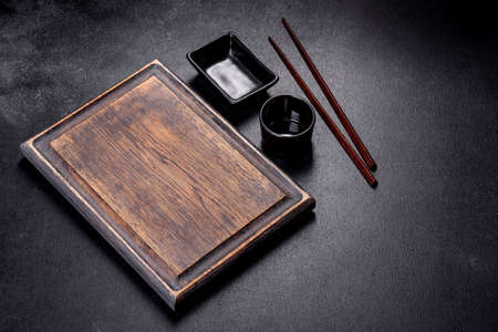 Wooden sushi sticks on a dark concrete background. Japanese Asian cuisineの写真素材