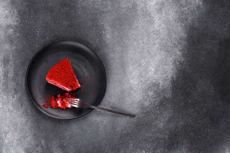 Red velvet cake, classic three layered cake from red butter sponge cakes with cream cheese frosting, American cuisineの写真素材