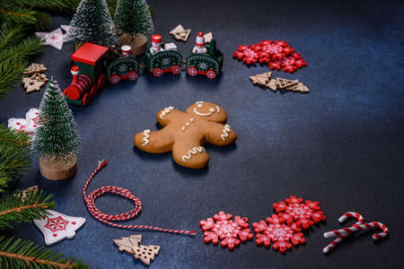 Christmas Decorations with Gingerbread man,fir tree branches and christmas backgroundの写真素材