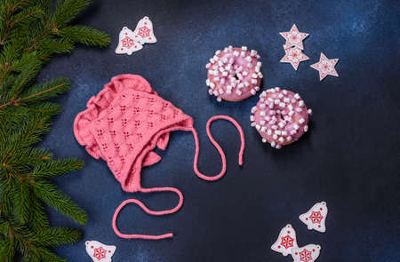 Pink cap for a young child. Clothing in the first days of the child's life. hat tied with your own handsの写真素材