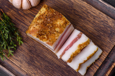 Salted Lard, Raw Pork with Spices on Wooden Cutting Board Studio Photoの写真素材