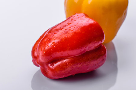 Fresh torn red sweet pepper from the autumn harvest. Preparing ingredients for a vegetarian dish