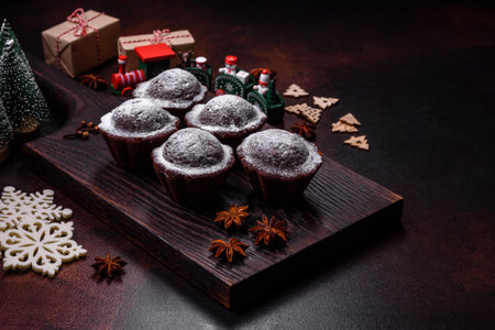 Sweet tasty fresh festive baking on a dark concrete background. Preparing for Christmas Eveの写真素材