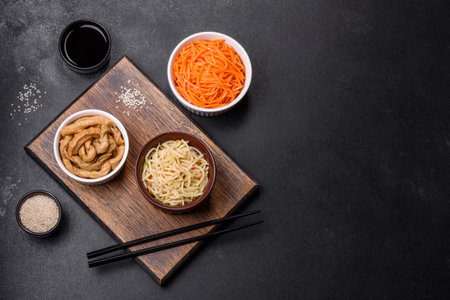 Tasty spicy Korean celery with spices and herbs on a dark concrete background. Asian foodの写真素材