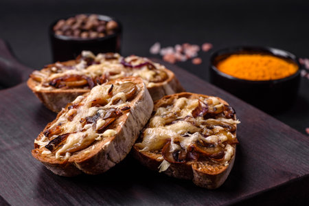 Delicious crispy toast or bruschetta with fried onion, champignon mushrooms and cheese with spices...