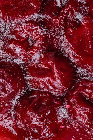 Delicious fragrant sweet pie with cherry berries on a ceramic plate on a dark concrete background