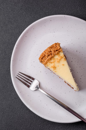 Delicious sweet cheesecake cake on textured concrete background. Delicious breakfast dessert
