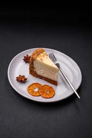 Delicious sweet cheesecake cake on textured concrete background. Delicious breakfast dessertの写真素材