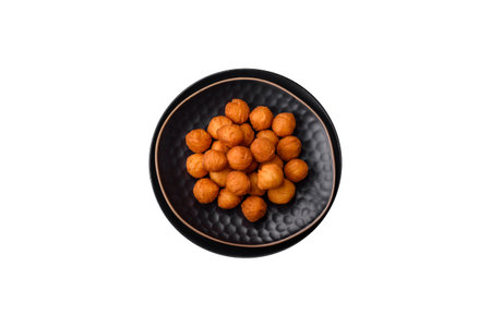 Delicious fried potato balls with breaded mozzarella, salt, spices and herbs on a dark concrete...