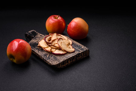 Delicious ripe red apple, sliced and dried in a special dryer. Ingredients for making dessertsの写真素材