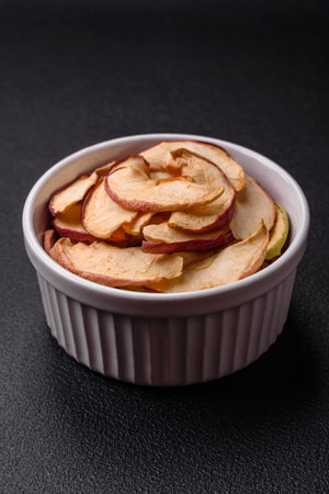 Delicious ripe red apple, sliced and dried in a special dryer. Ingredients for making dessertsの写真素材