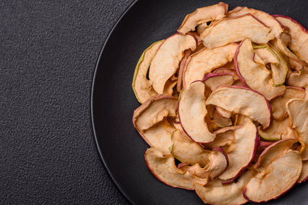 Delicious ripe red apple, sliced and dried in a special dryer. Ingredients for making dessertsの写真素材