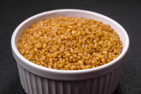 Raw bulgur wheat porridge as an ingredient for preparing a delicious dish. Turkish cuisine dish