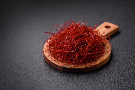 Red thin hot chili threads on a dark background. For decorating Asian dishes