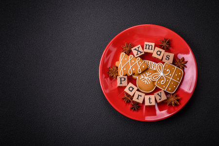 Christmas party inscription with wooden cubes on a dark concrete background. Postcard with copy space for your designの写真素材