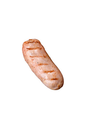 Delicious juicy sausages of several varieties grilled with salt, spices and herbs on a dark concrete backgroundの写真素材