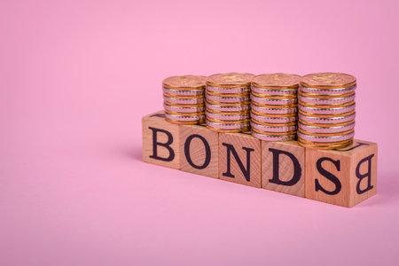 The inscription Bonds made of wooden cubes on a plain background. Can be used for your designの写真素材