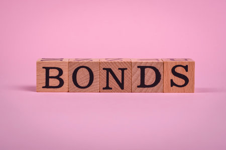 The inscription Bonds made of wooden cubes on a plain background. Can be used for your designの写真素材
