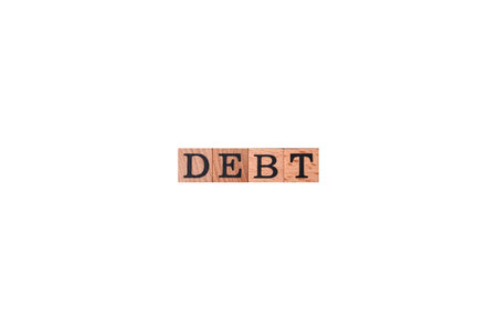 The inscription Debt inspection made of wooden cubes on a plain background. Can be used for your designの写真素材