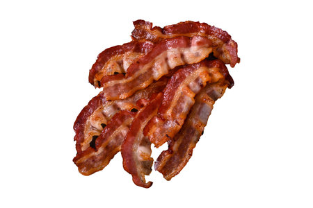Delicious fresh fried bacon with salt and spices on a dark background as an ingredient for preparing a hearty breakfastの写真素材