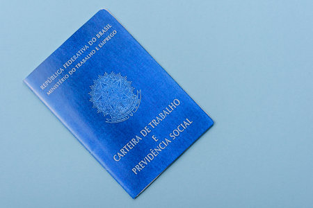Physical paper international passport of a Brazilian citizen on a blue backgroundの写真素材