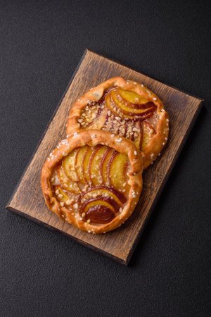 Delicious sweet crispy galettes with fruits and cinnamon baked at homeの写真素材