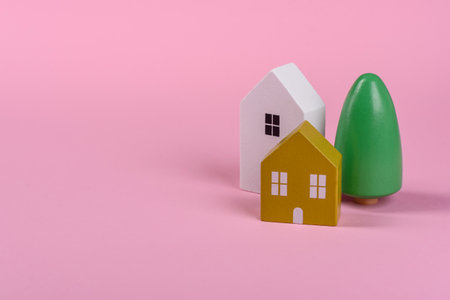 Wooden toy house as a conceptual background for purchasing real estate, renting out a home or investing in real estateの写真素材