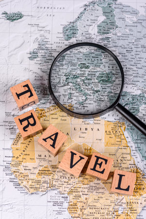 Conceptual background for travel with passport, magnifying glass, world map and money. Wallpaper for...