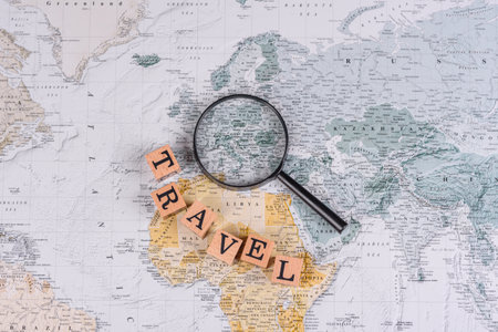 Conceptual background for travel with passport, magnifying glass, world map and money. Wallpaper for...