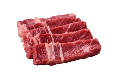 Fresh raw beef cut into slices with salt, spices on a dark concrete backgroundの写真素材