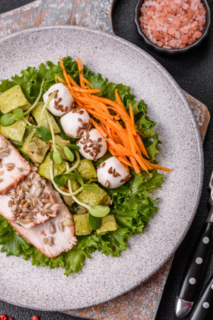 Delicious diet salad with turkey or chicken slices, lettuce, carrots, mozzarella, corn and zucchini. Diet foodの写真素材