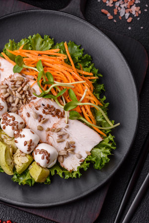 Delicious diet salad with turkey or chicken slices, lettuce, carrots, corn and zucchini. Diet foodの写真素材