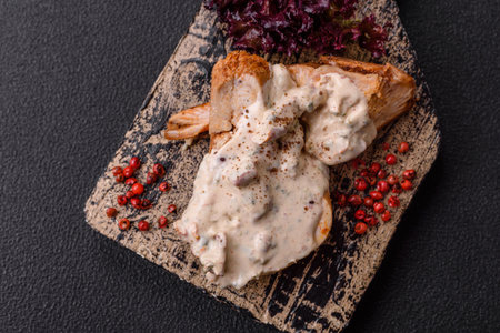 Asian food baked chicken breast with green beans, sesame seeds and sauce on dark concrete backgroundの写真素材