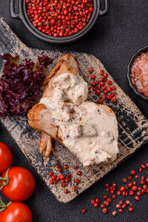 Asian food chicken breast with green beans, sesame seeds and sauce on dark concrete backgroundの写真素材