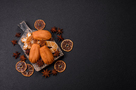 Classic madeleine sponge cake with elements of Christmas motifs. Preparing for the holidayの写真素材