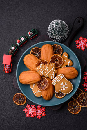 Classic madeleine sponge cake with elements of Christmas motifs. Preparing for the holidayの写真素材