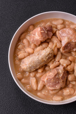 Cassoulet with white beans, meat and sausages, vegetables, salt and spices as a classic French foodの写真素材